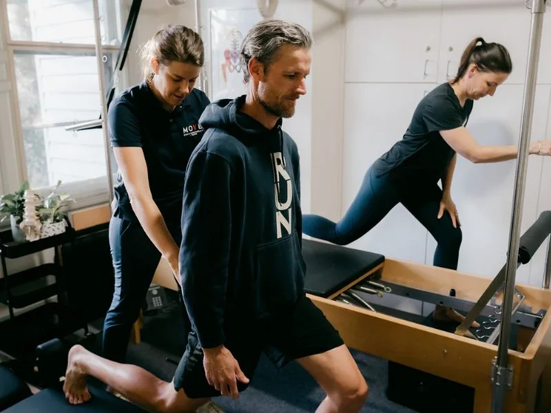 Clinicians observing a practical reformer demonstration during a Clinical Pilates Collective mentoring session